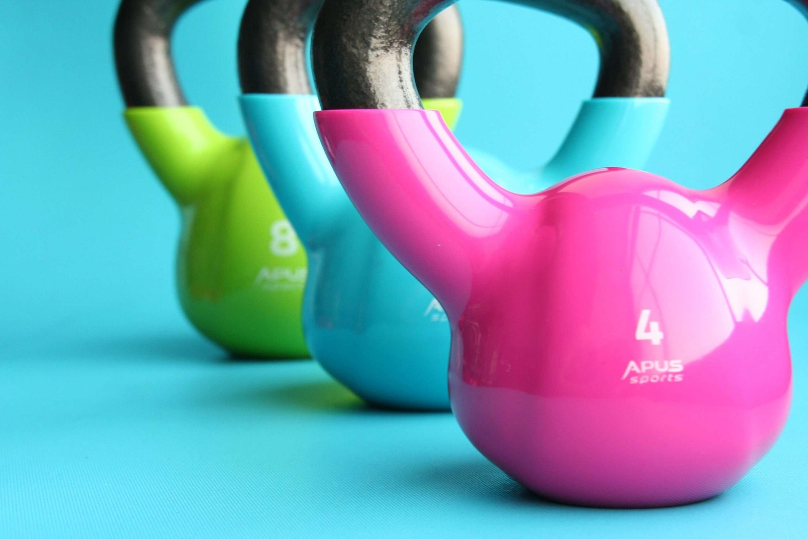 a group of colorful kettlebells