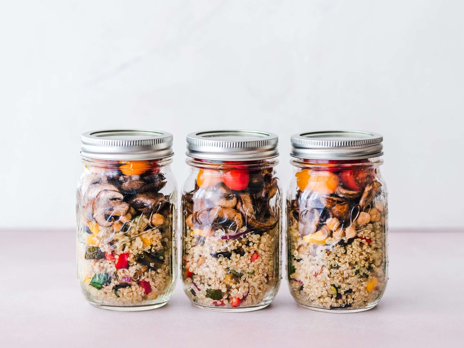 a group of jars with food in them