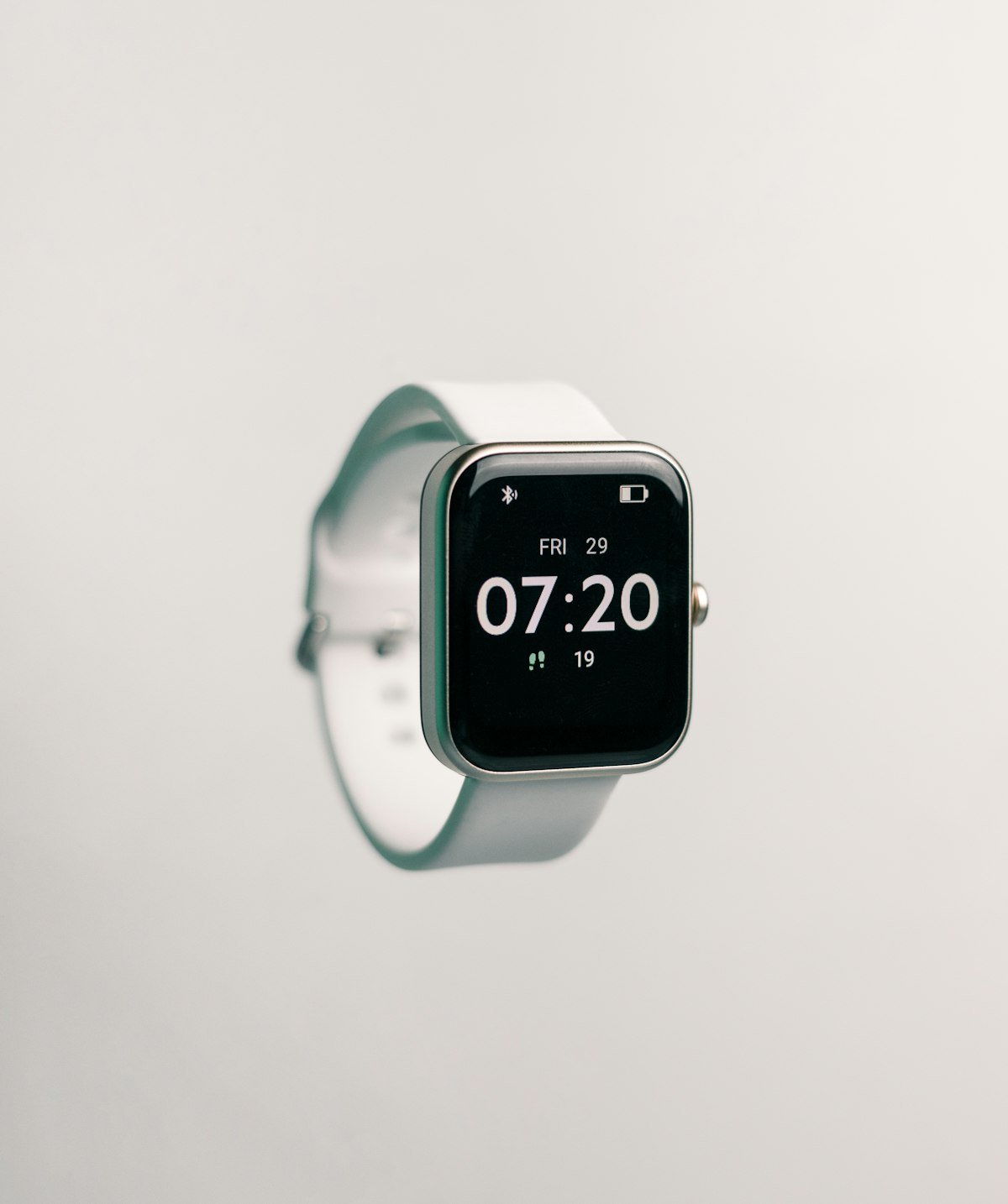A wrist wearable showing a heart rate reading