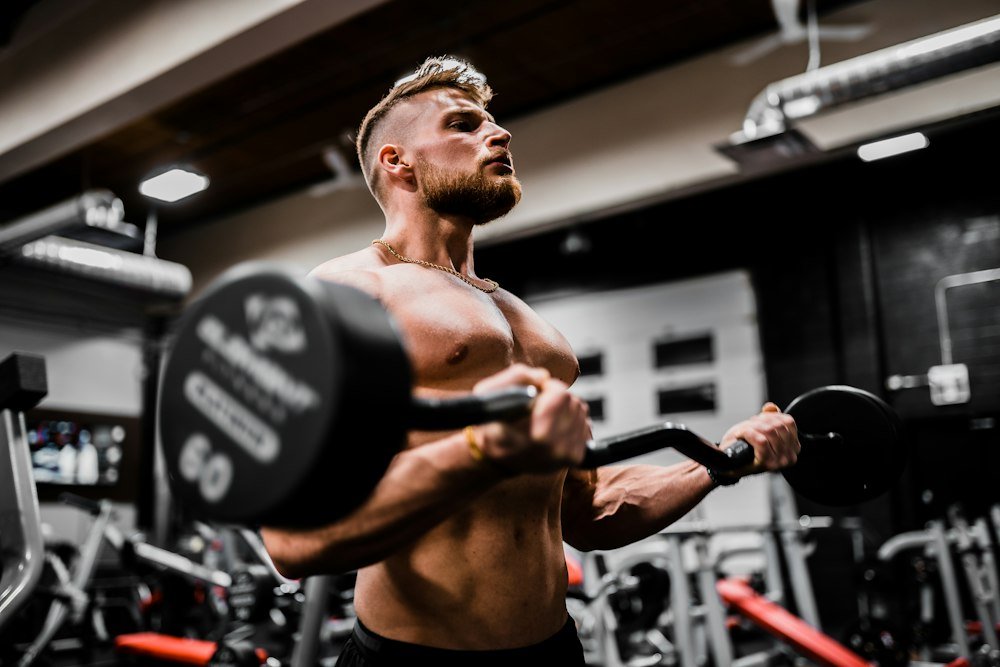 Man holding a dumbbell during a strength workout