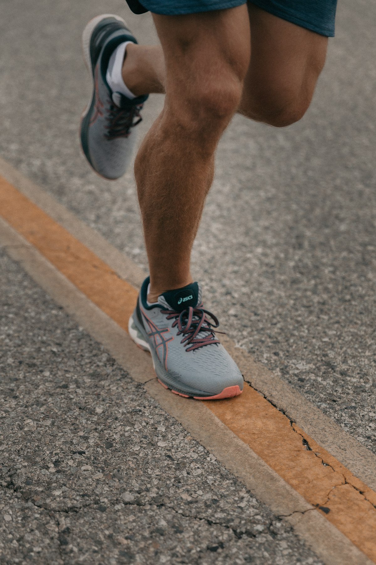 Close-up of walking shoes on a paved path